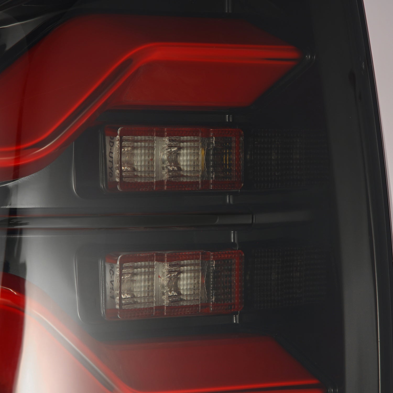 AlphaRex 16-21 Toyota Tacoma LUXX LED Taillights Blk/Red w/Activ Light/Seq Signal